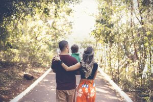 walking parents, holding the child together